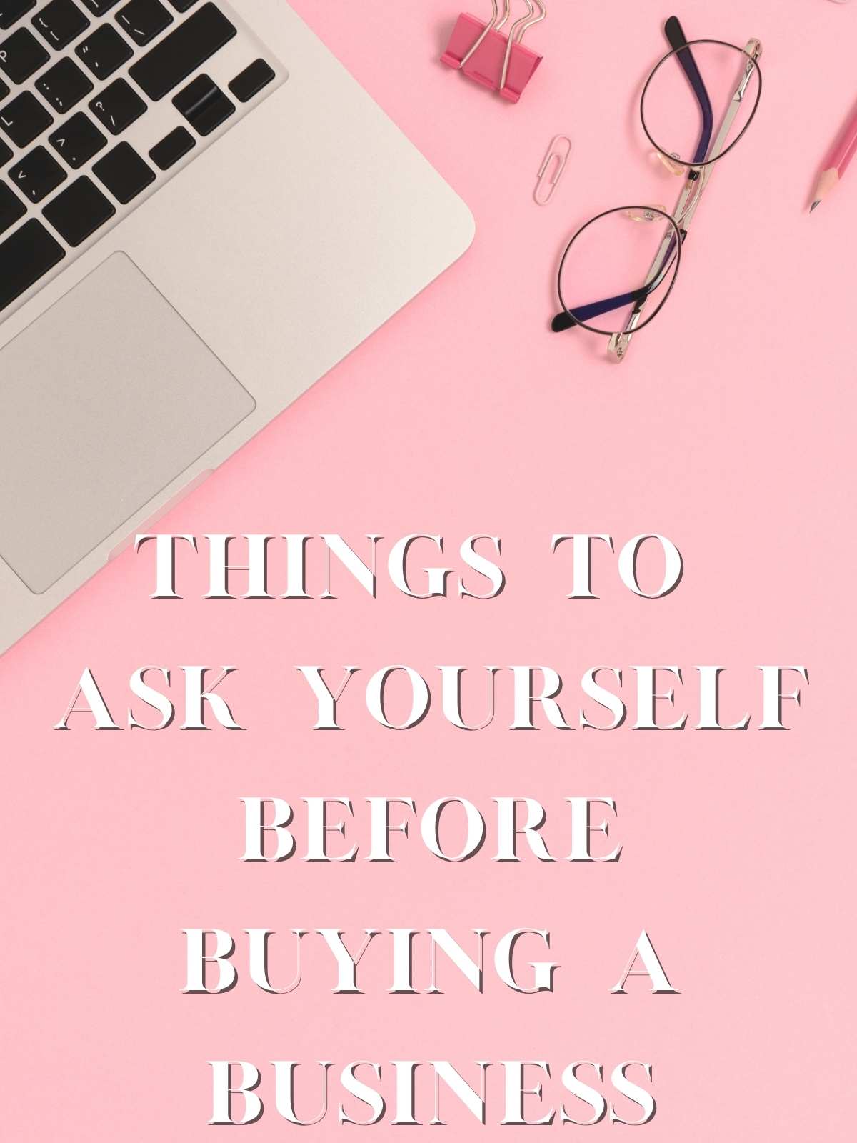 Things to ask yourself before buying a business. Photo of laptop and glasses