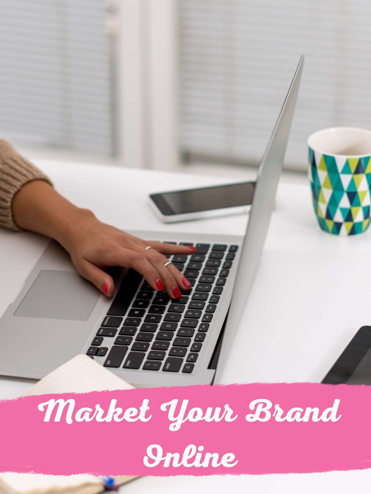 Market your brand online. Person working on laptop