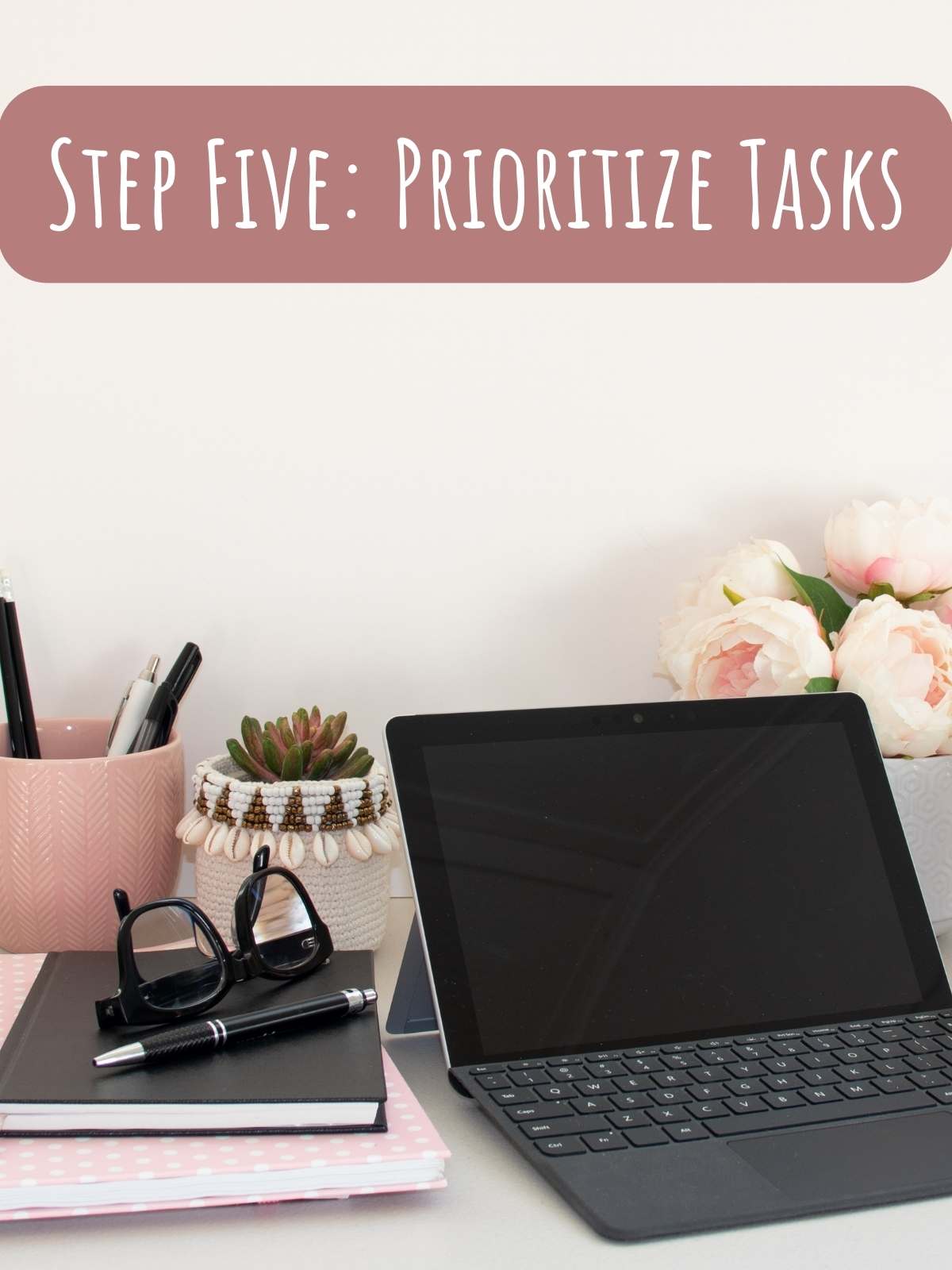 Step Five: Prioritize tasks. Photo of desk setup.